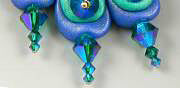 Clay peacock tail feathers with glass beads